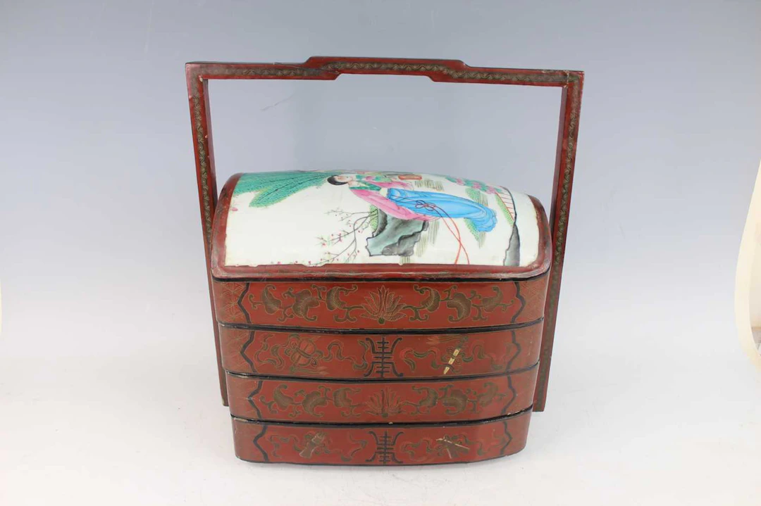 Lot 173 - A Chinese red lacquered four-tier food box