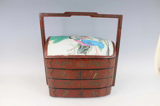 Lot 173 - A Chinese red lacquered four-tier food box