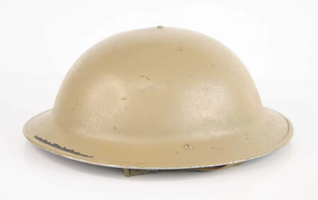 Lot 1022 - A WW II Brodie pattern steel helmet, having