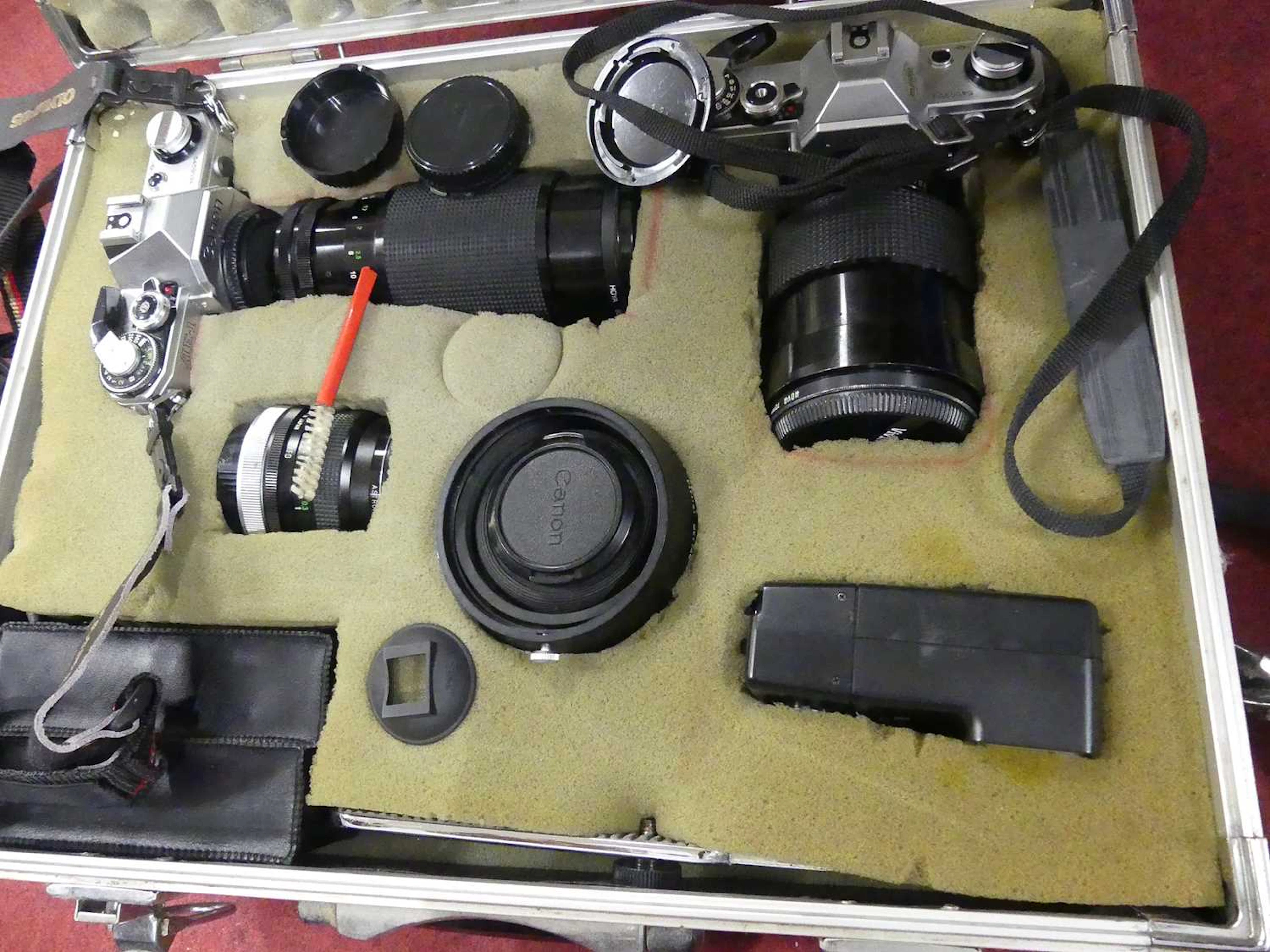 Lot 80 - A Canon AE-1 camera body, together with