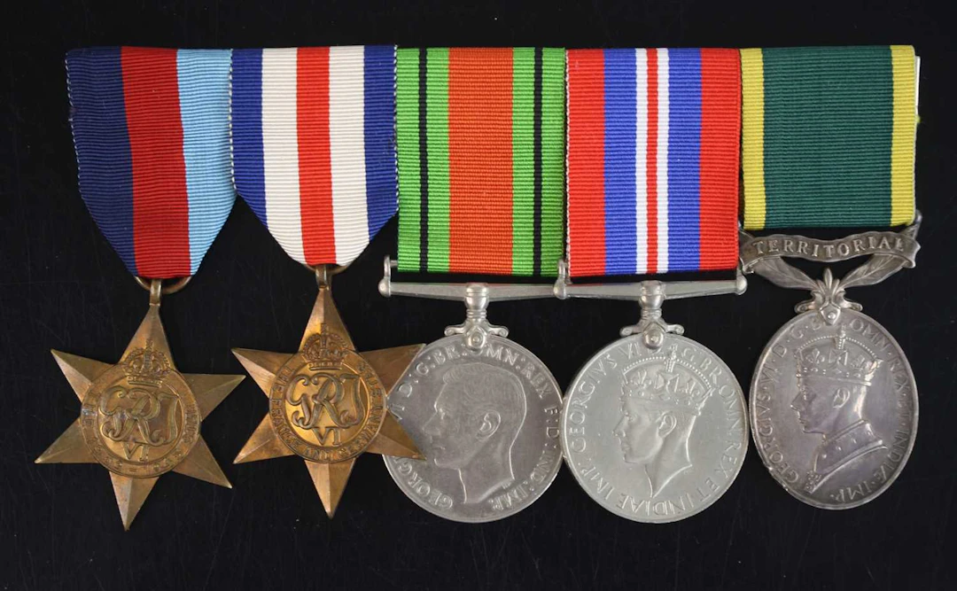 Lot 1271 - A group of five medals to include WW II