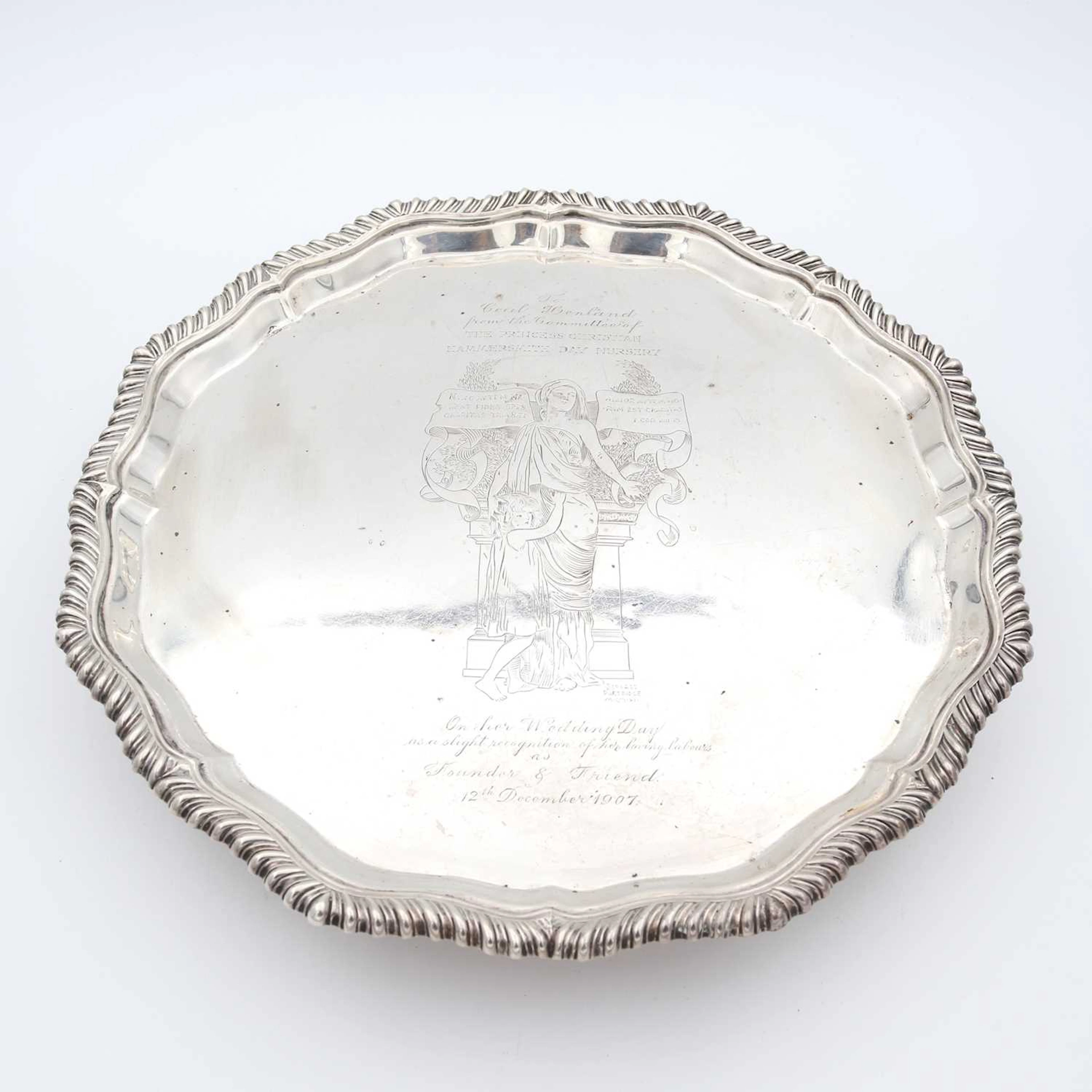 Lot 68 - An Edwardian silver presentation salver, of