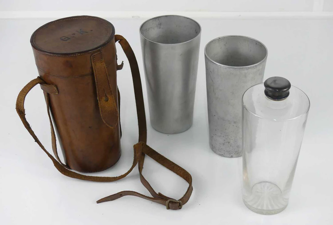 Lot 1309 - An EPNS mounted glass conical hunting flask