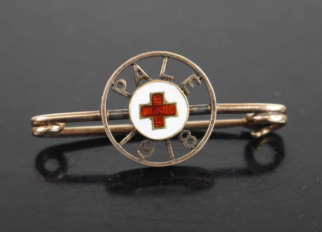 Lot 1028 - A WW I yellow metal sweetheart brooch, the