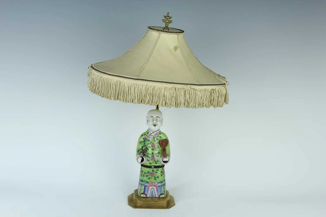 Lot 142 - A Chinese famille rose figure of a boy
