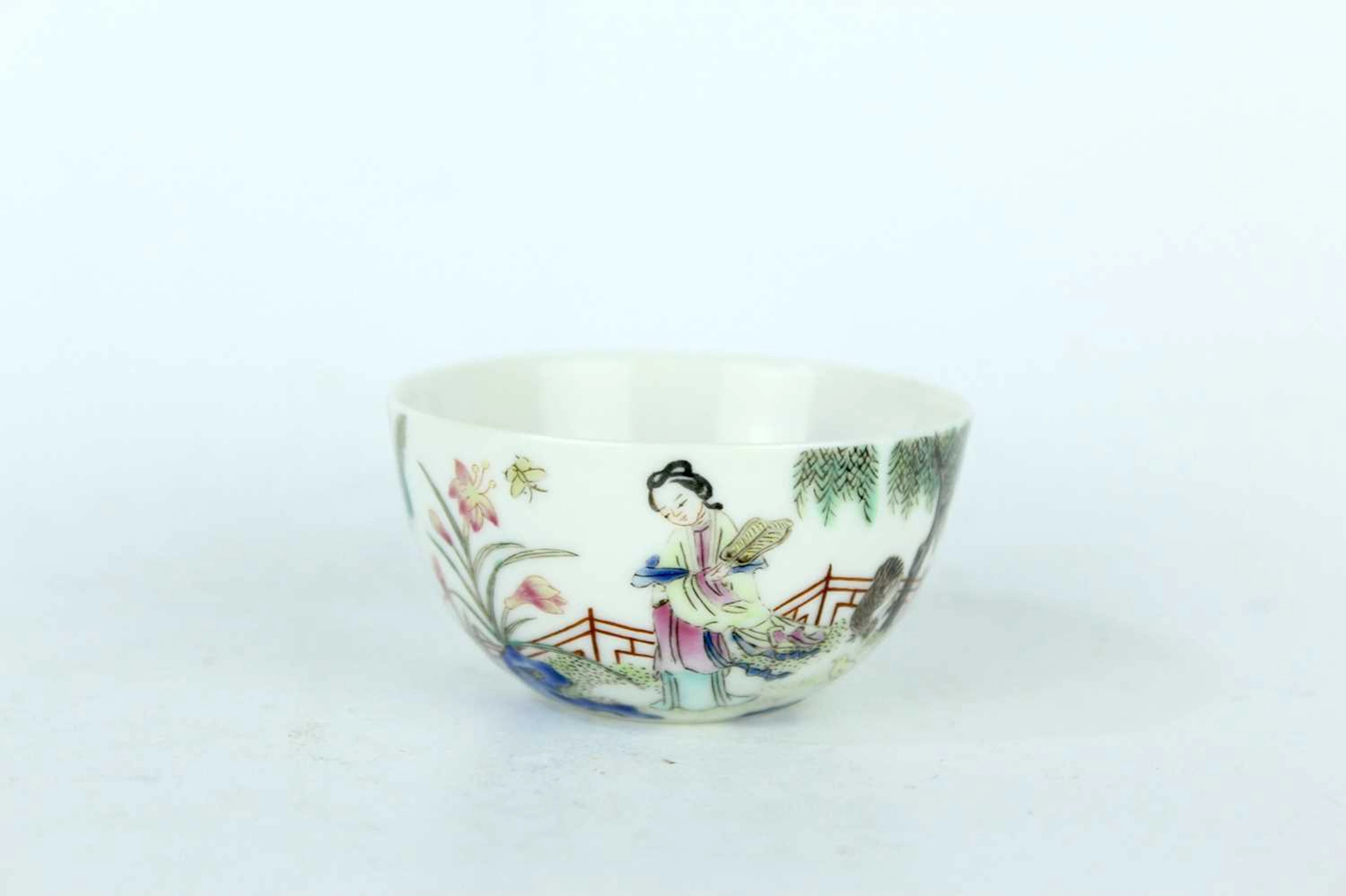 Lot 112 - A small Chinese famille rose 'lady and boy'