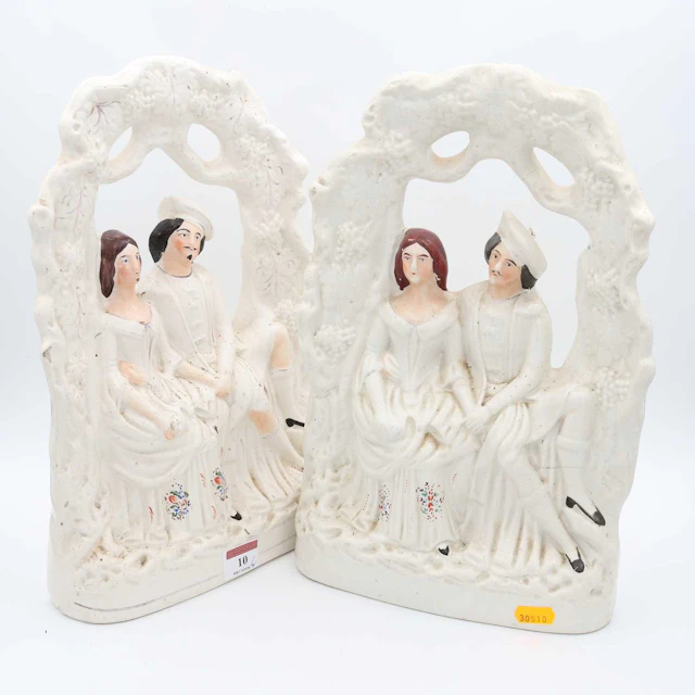 Lot 10 - Two Staffordshire pottery figure groups of a