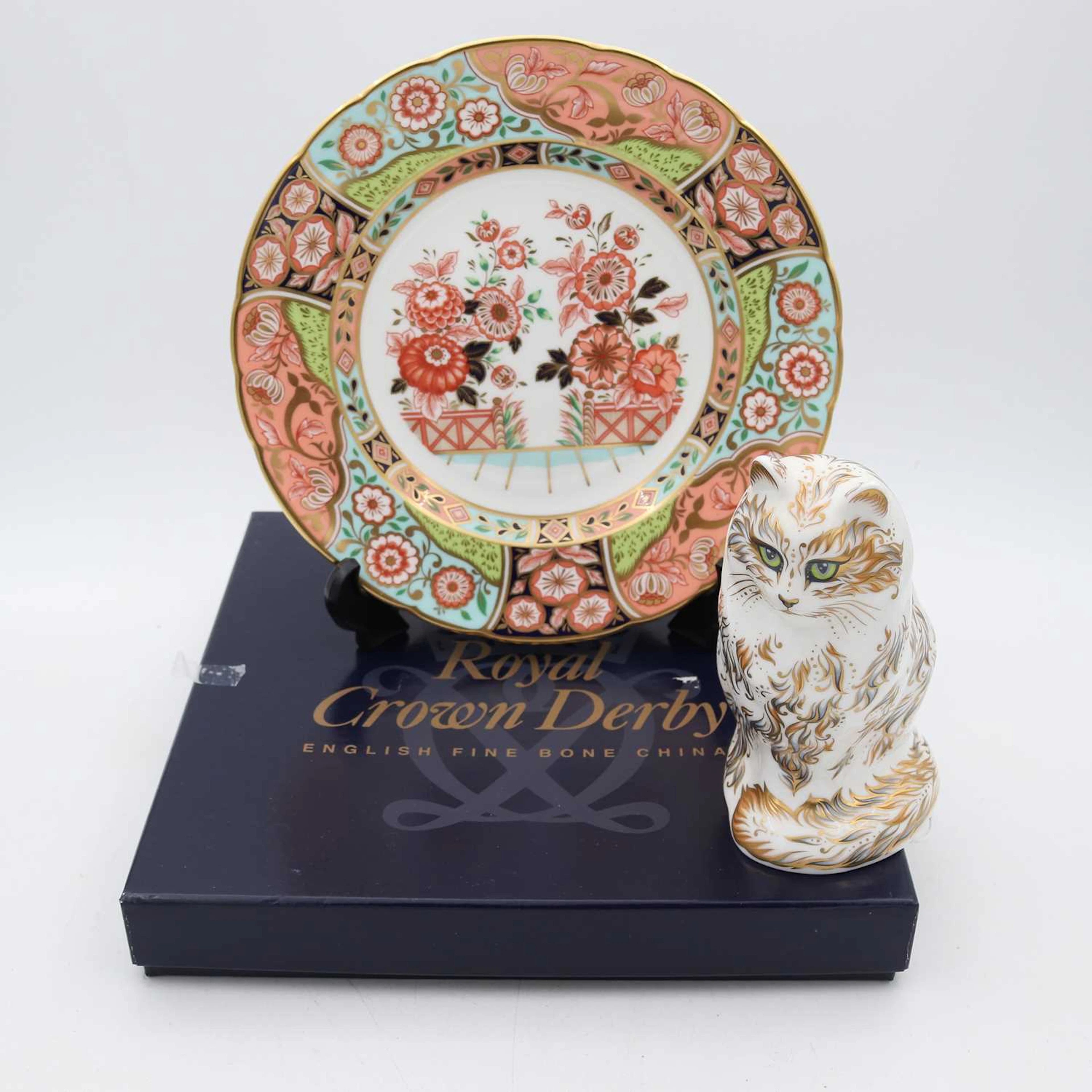 Lot 102 - A Royal Crown Derby porcelain paperweight