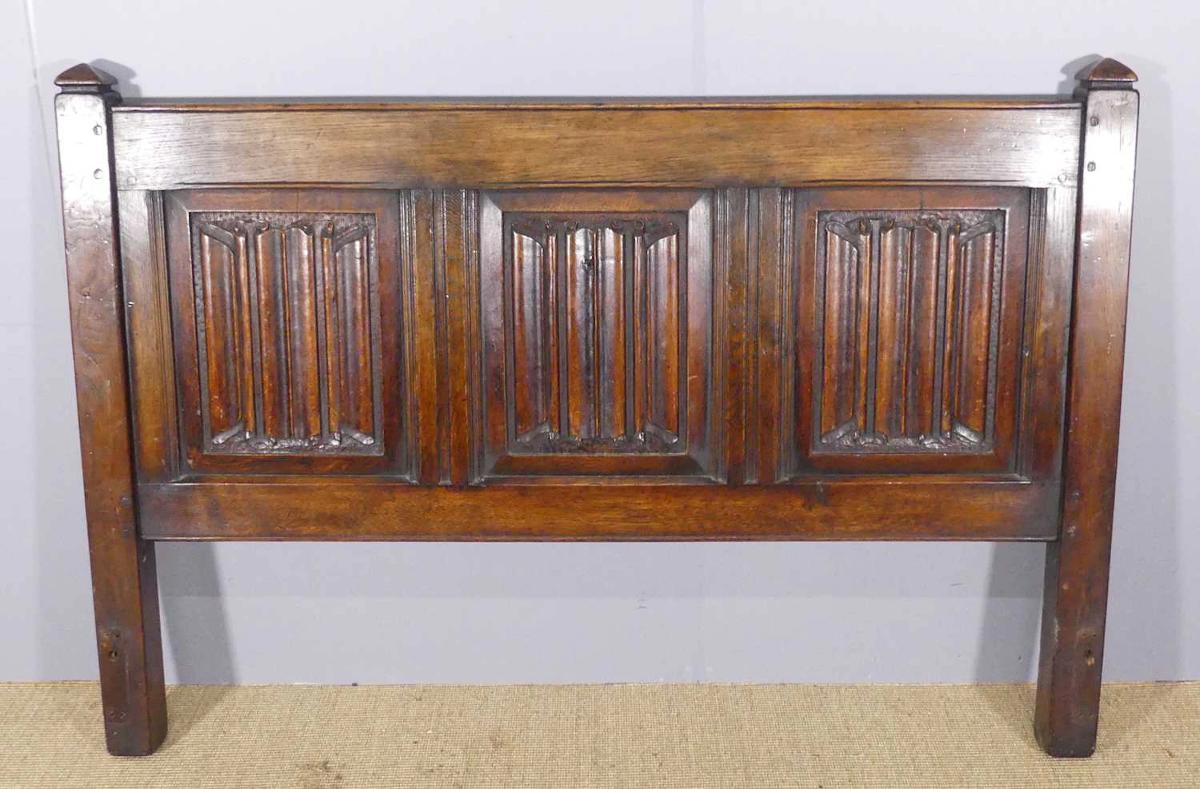 Lot 605 - A linenfold panelled joined oak double