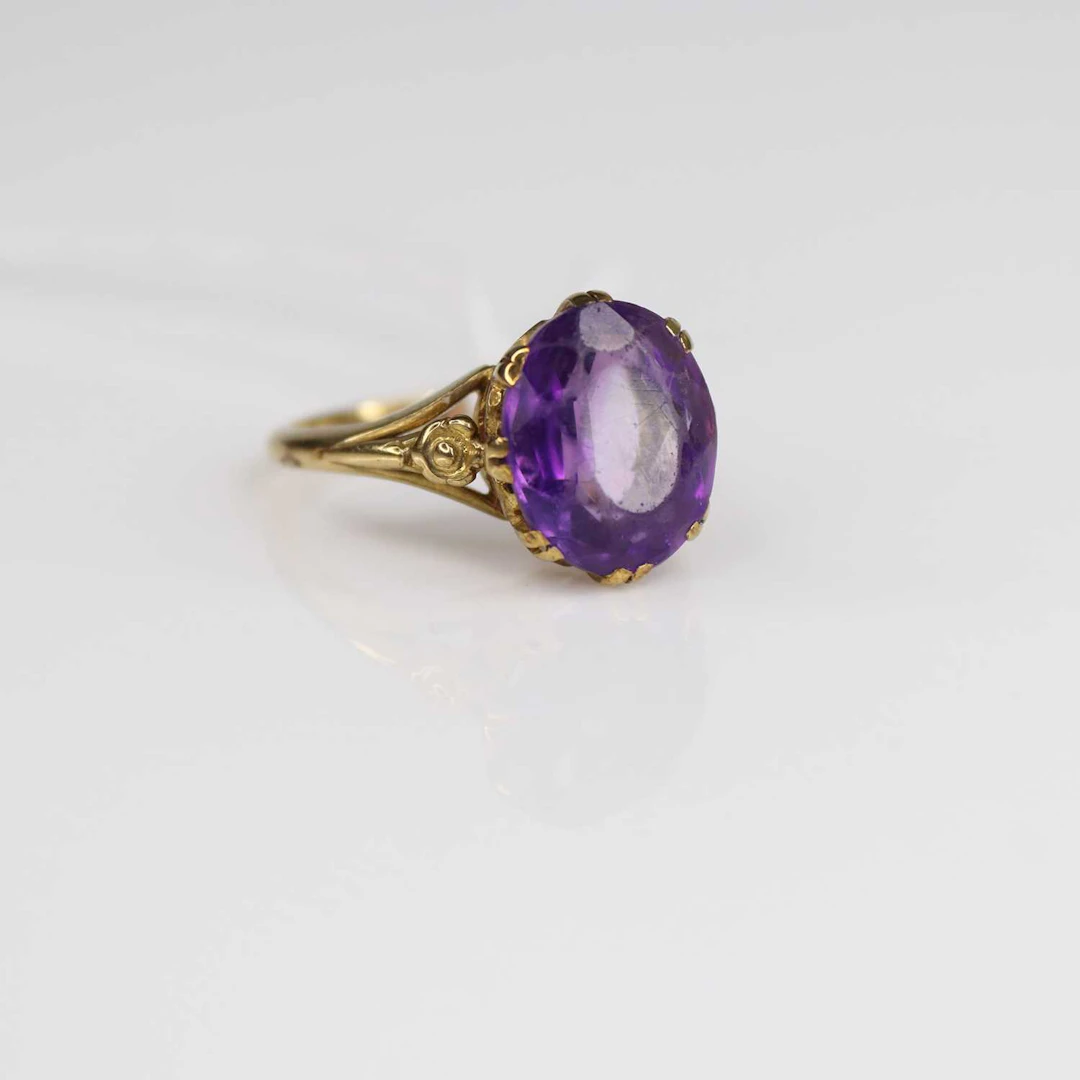 Lot 218 - A 9ct gold and amethyst set dress ring, the