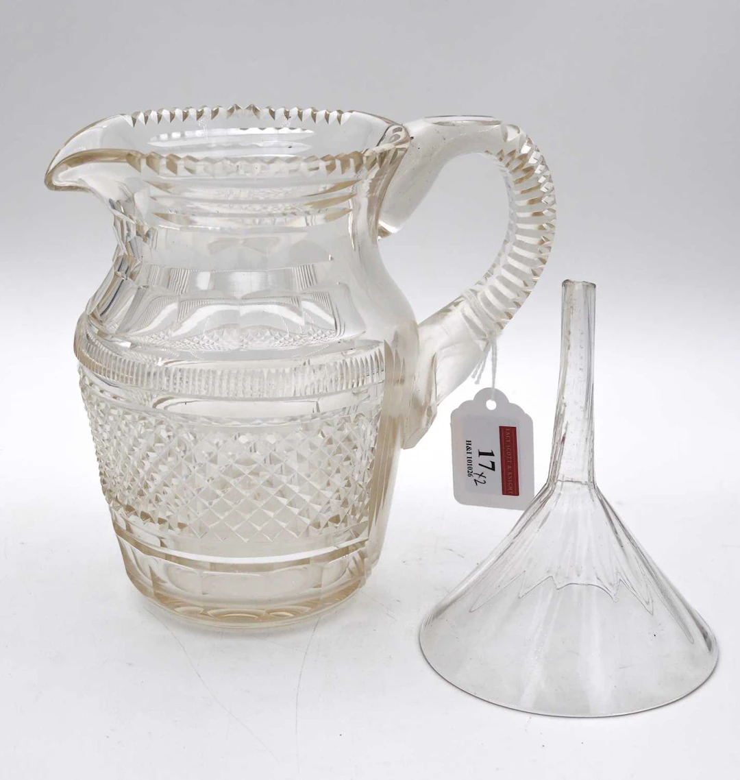 Lot 17 - A George III Irish cut glass jug, h.18cm;