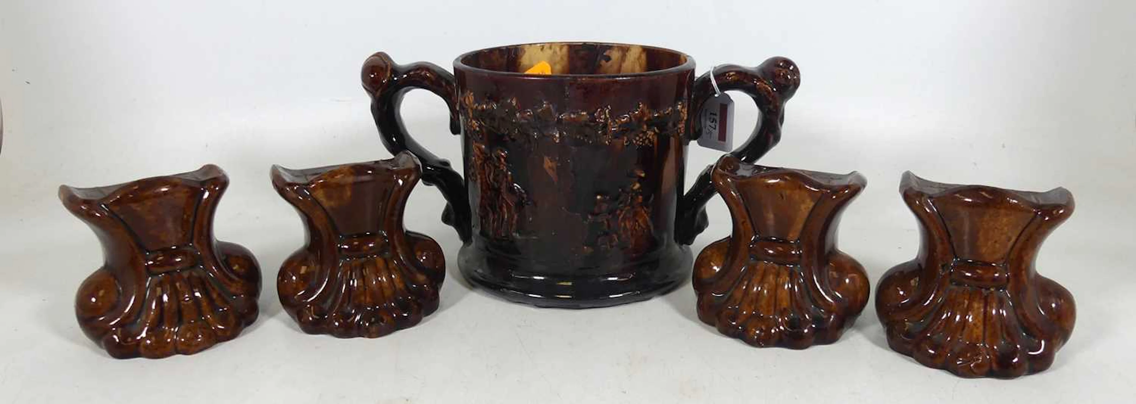 Lot 157 - A large Victorian treacle glazed loving cup
