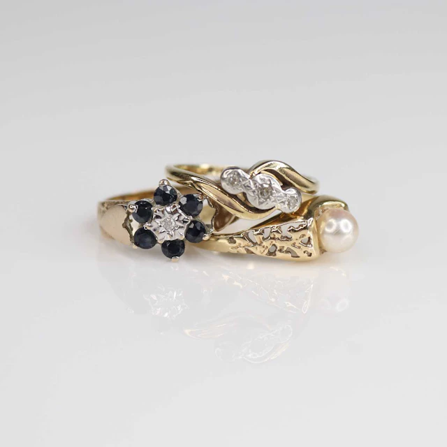 Lot 224 - Three rings, being a yellow and white metal
