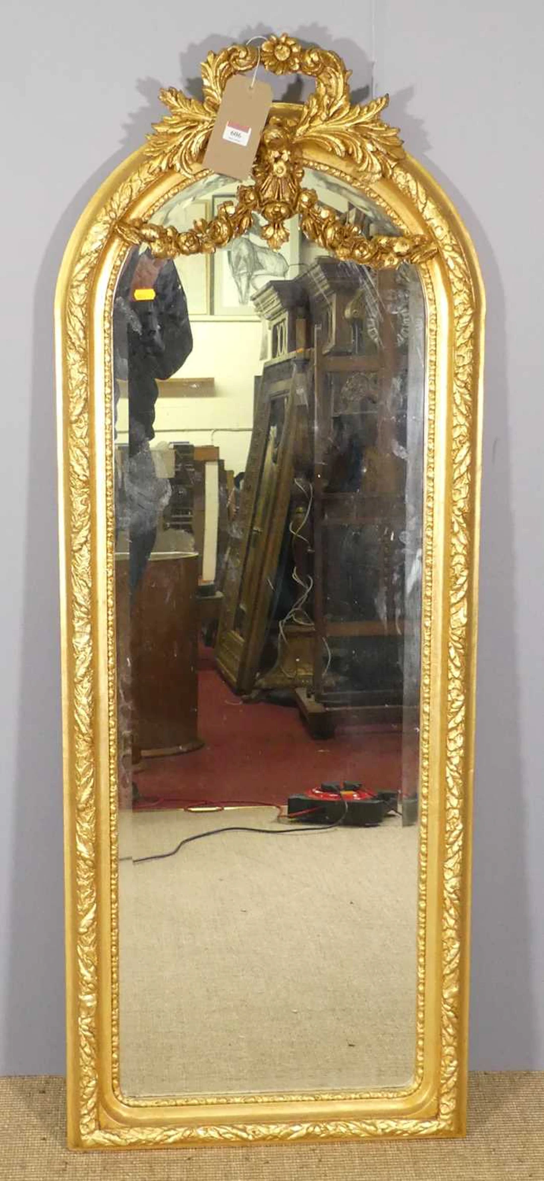 Lot 606 - A contemporary floral gilt framed arched