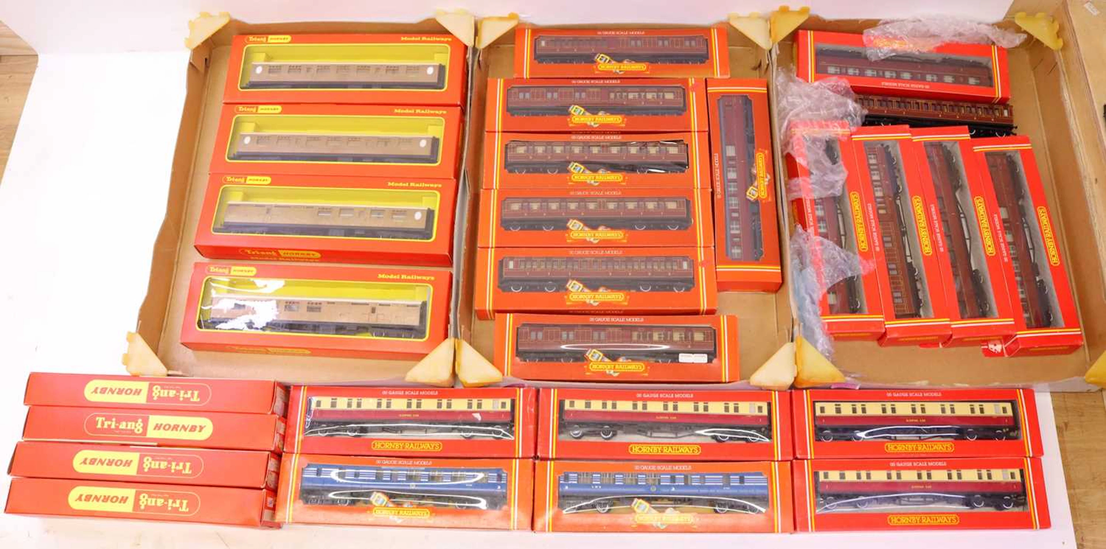 Lot 675 - Four trays containing boxed Triang 00 gauge