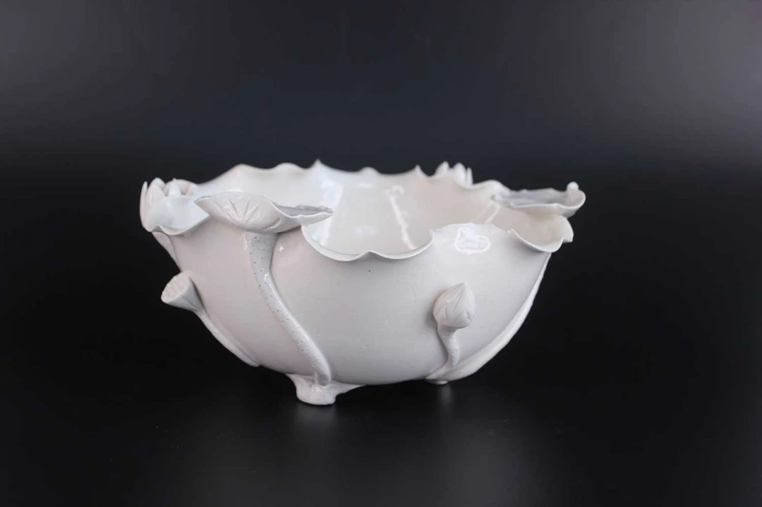 Lot 47 - A Chinese White-Glazed Lotus-Form Bowl