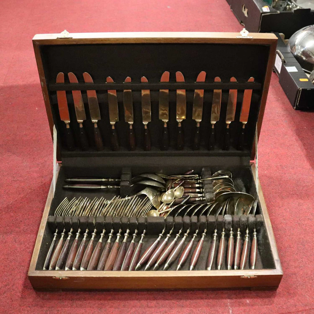 Lot 270 - A part suite of hardwood and brass flatware