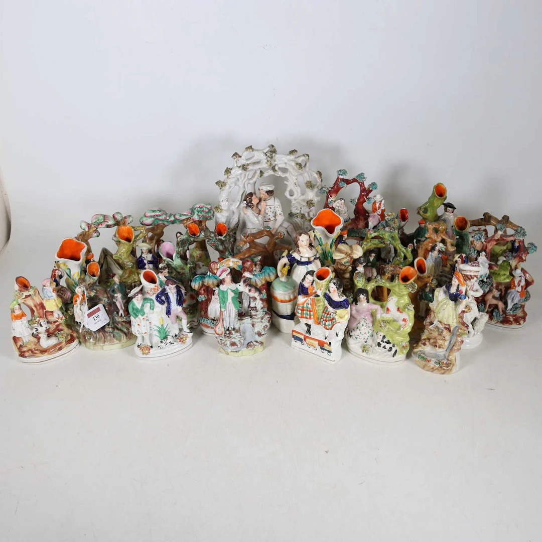 Lot 130 - A collection of Staffordshire figures, to