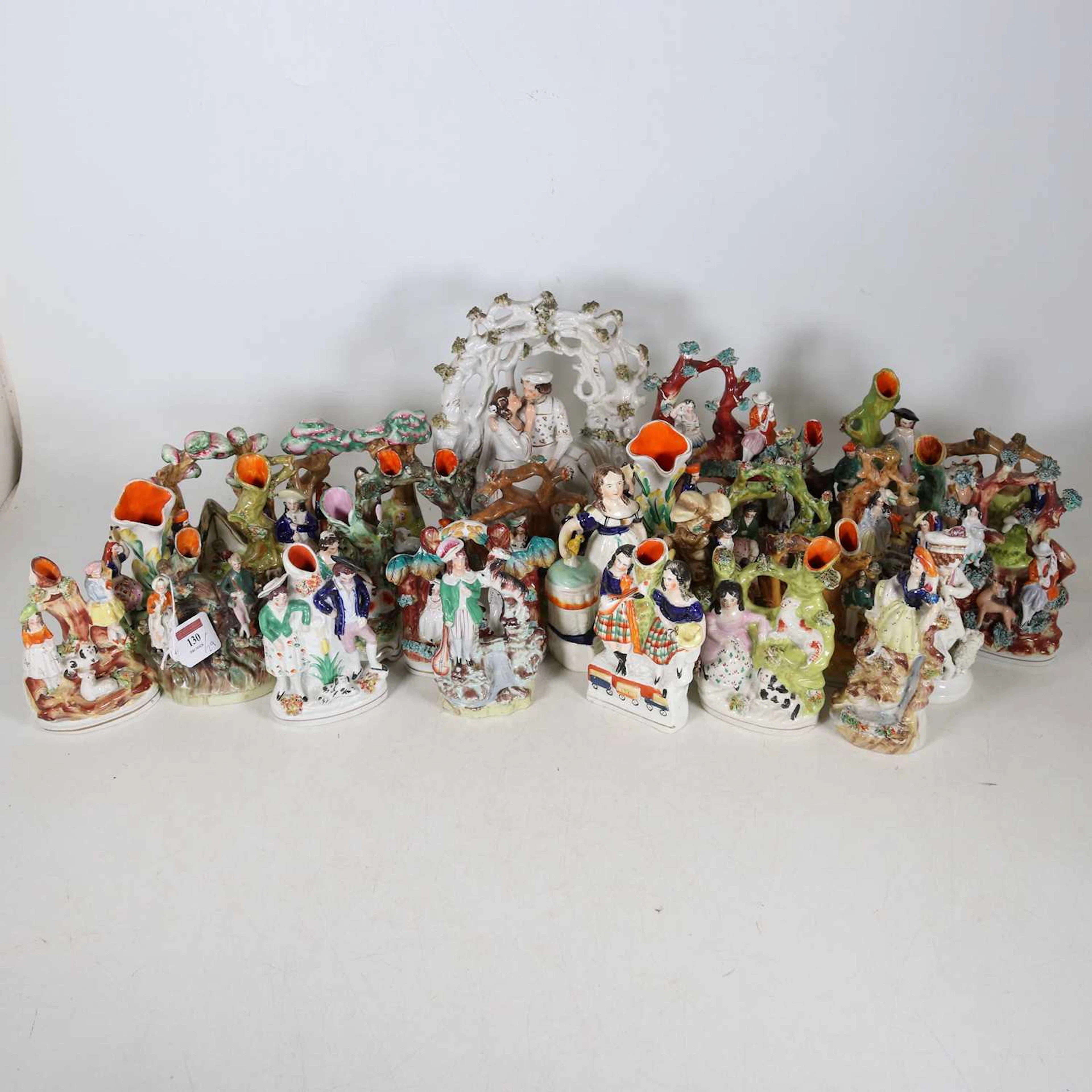 Lot 130 - A collection of Staffordshire figures, to