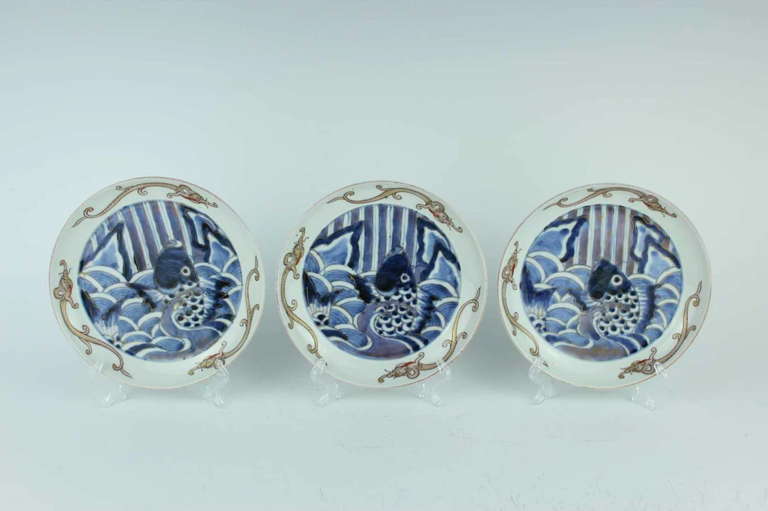 Lot 195 - Three Japanese blue and white and gilt