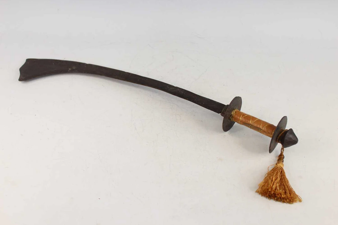 Lot 226 - A Nepalese curved iron sword, probably 19th