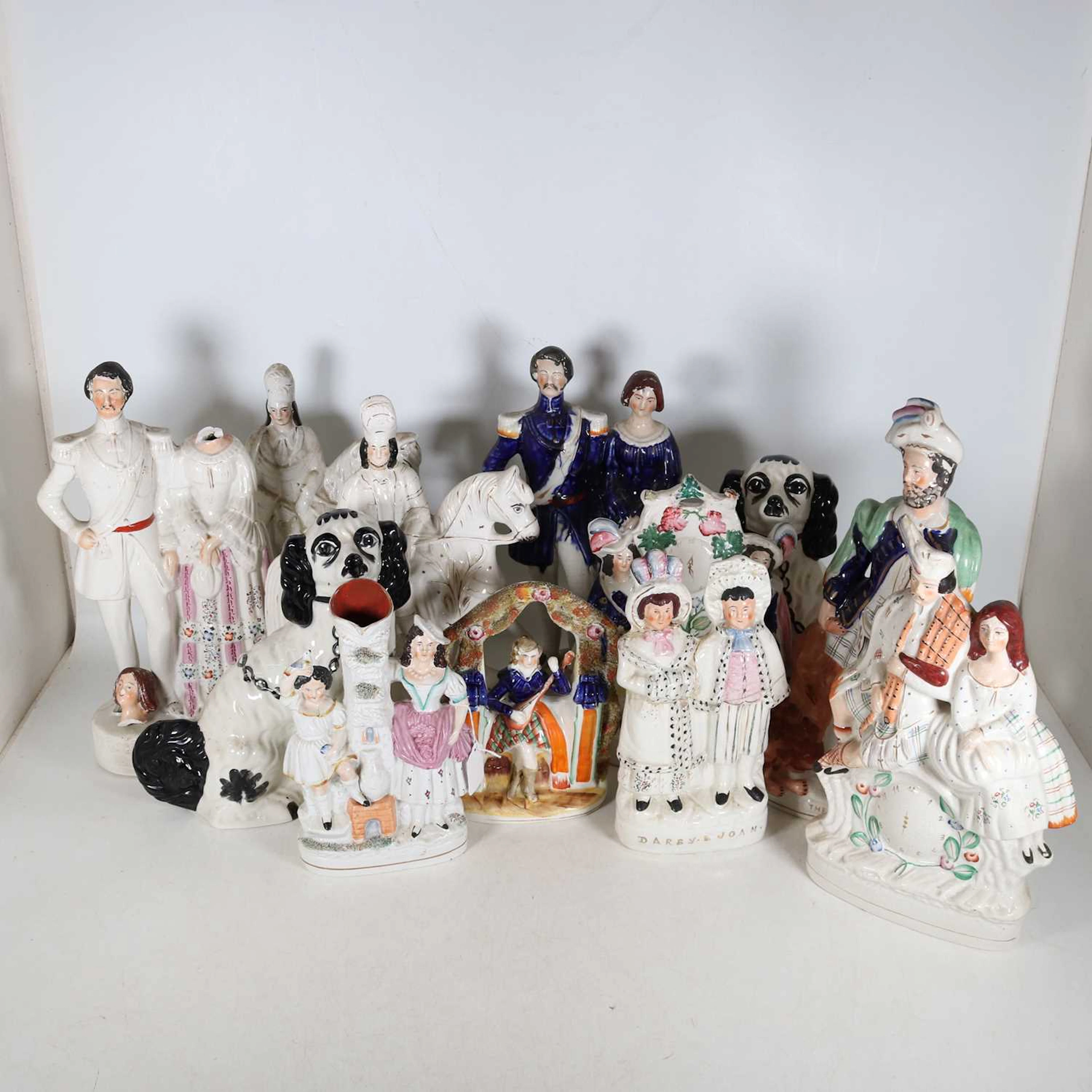Lot 139 - A collection of Staffordshire figures, to