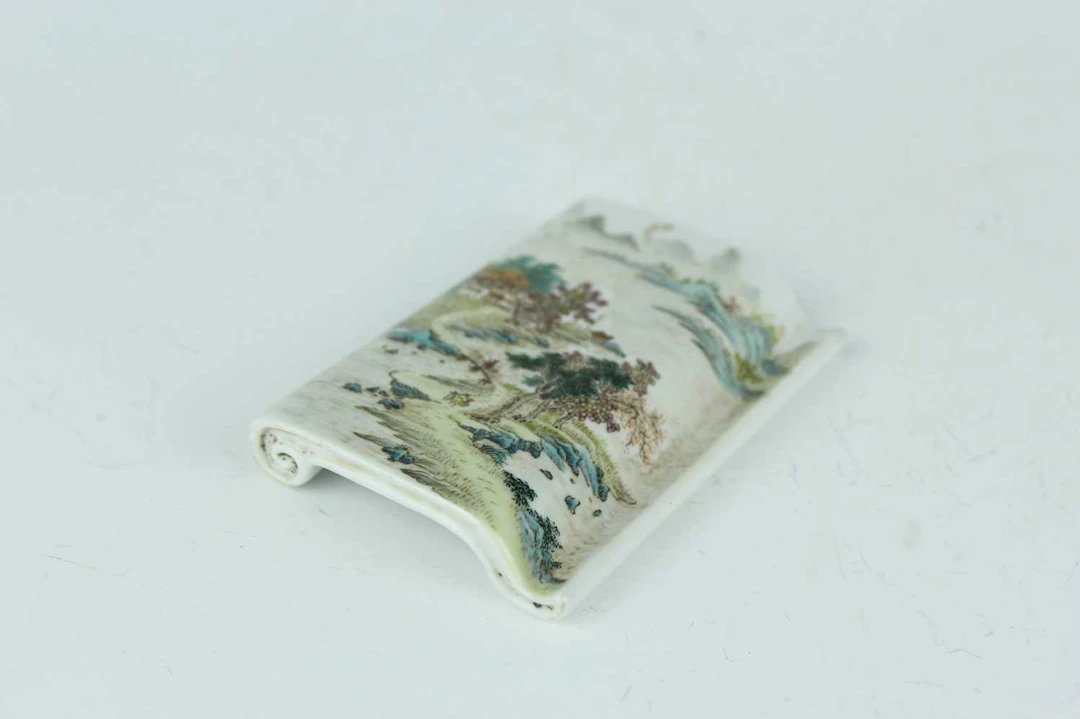 Lot 150 - A Chinese famille rose scroll-shaped
