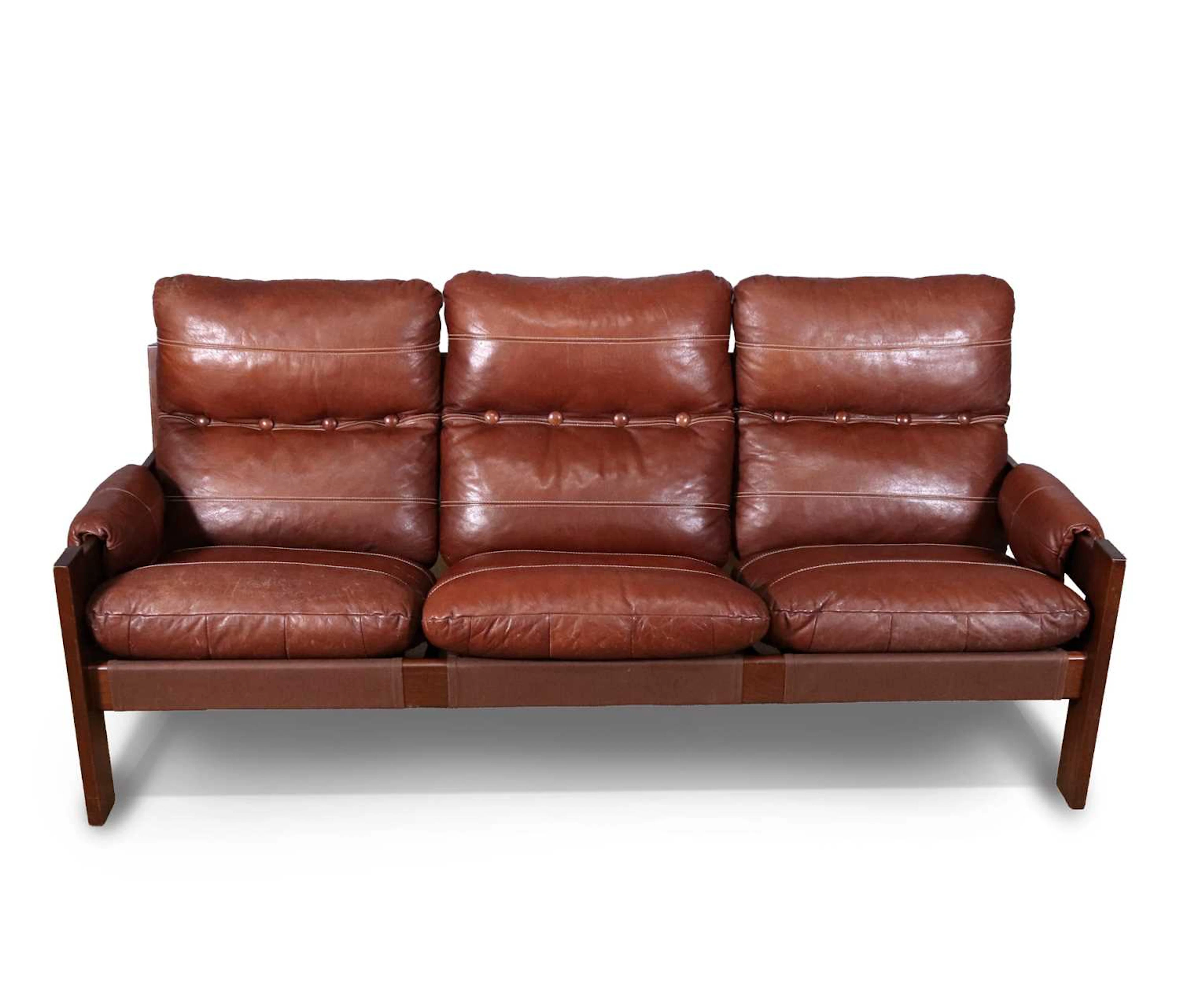 Lot 486 - A 1970s Danish hardwood framed three seater