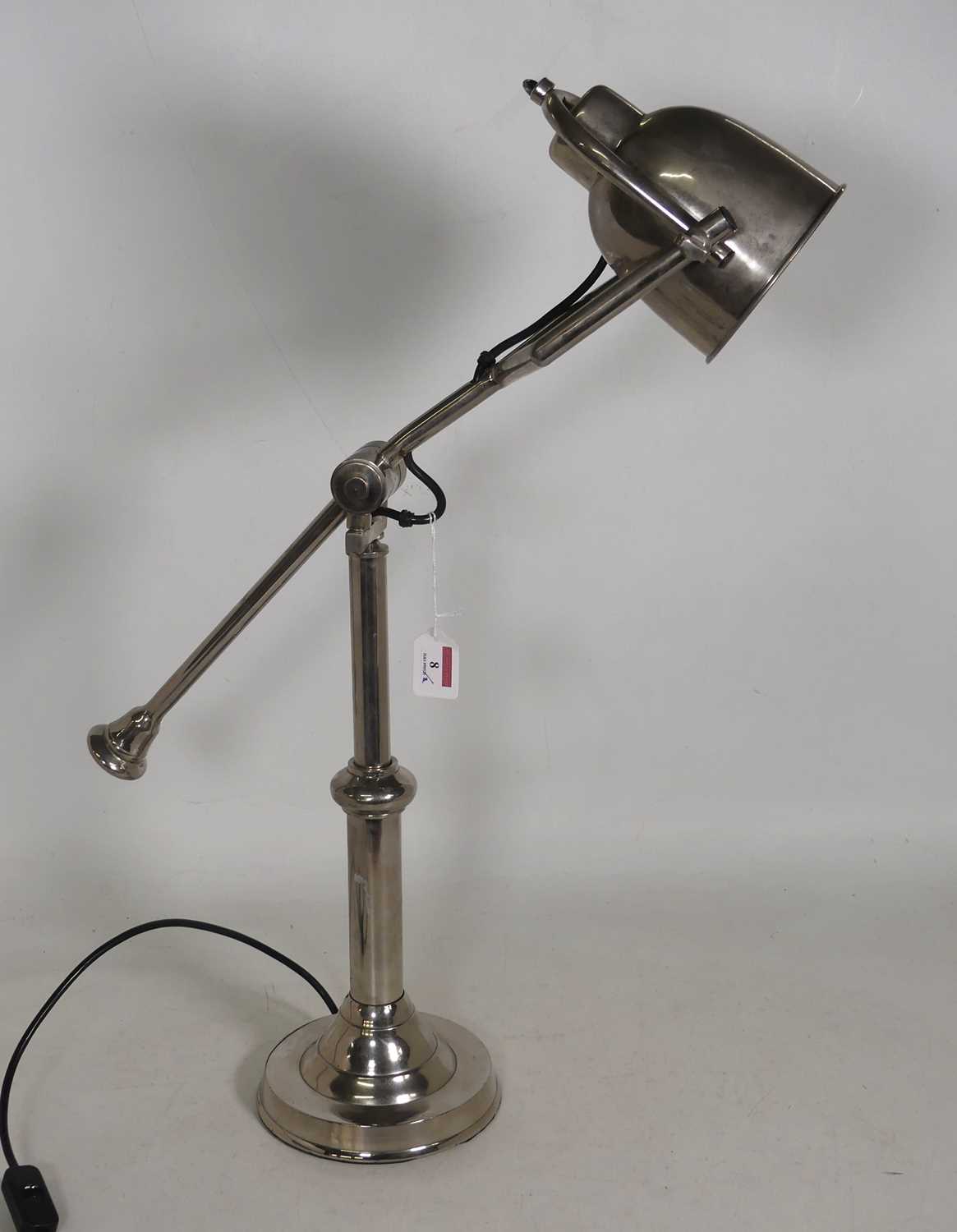 Lot 8 - A polished metal weighted desk lamp, h.70cm