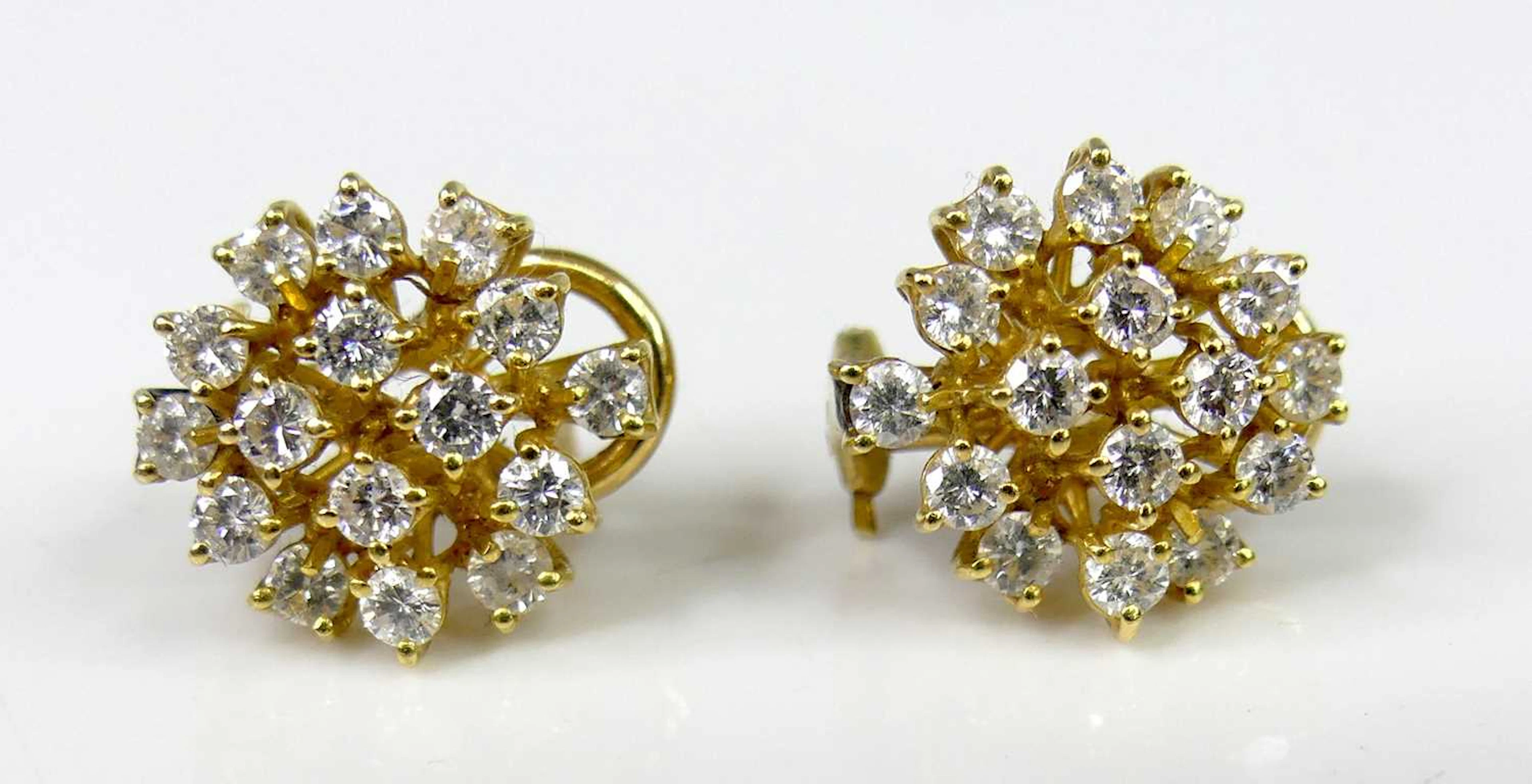 Lot 2566 - A pair of 18ct gold diamond cluster ear