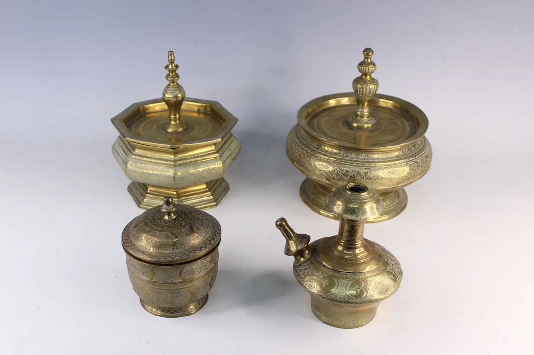 Lot 220 - Four Indonesian Engraved Brass Vessels, 20th