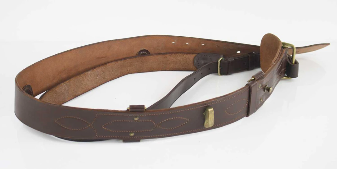 Lot 1153 - A brown leather Sam Browne belt, with brass