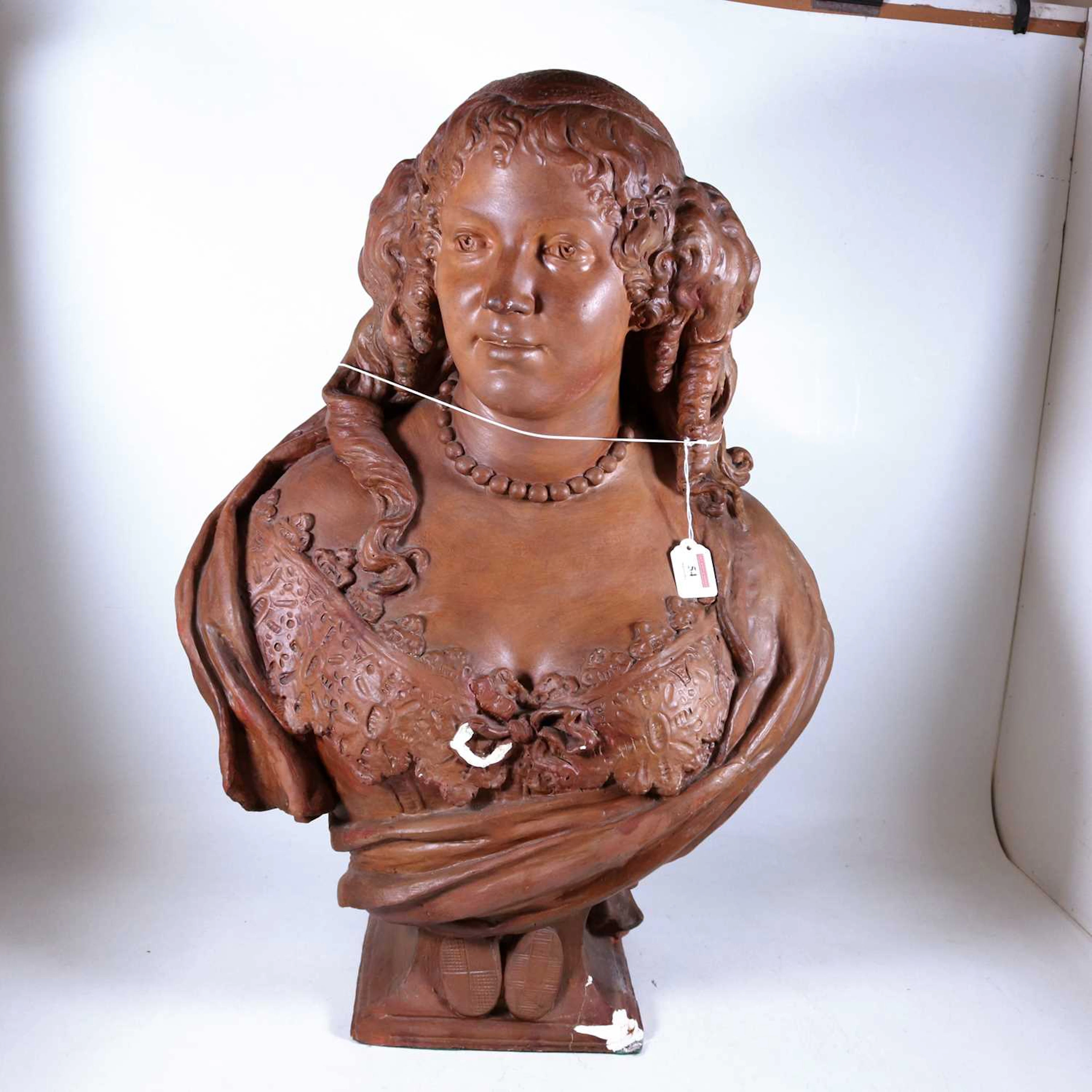 Lot 54 - A painted head and shoulders bust of a lady