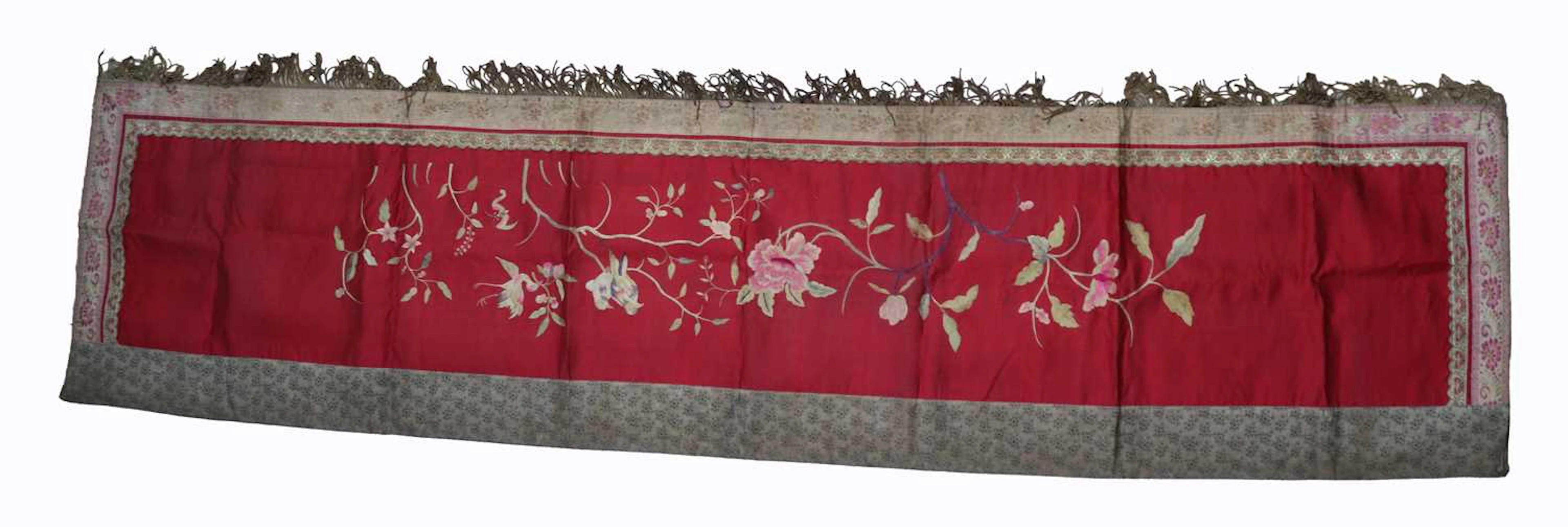 Lot 93 - A Chinese embroidered red silk floral panel