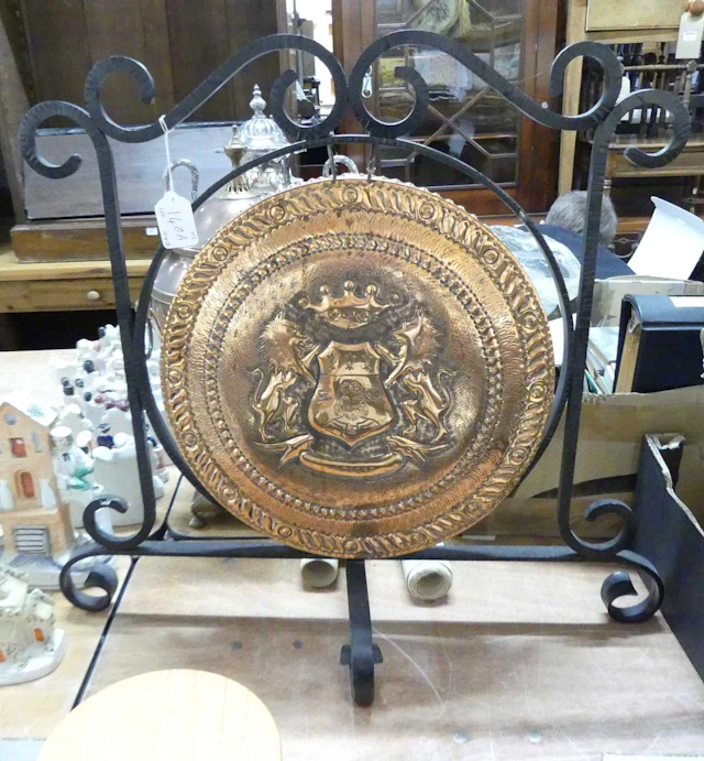 Lot 140 - A French repousse decorated brass gong