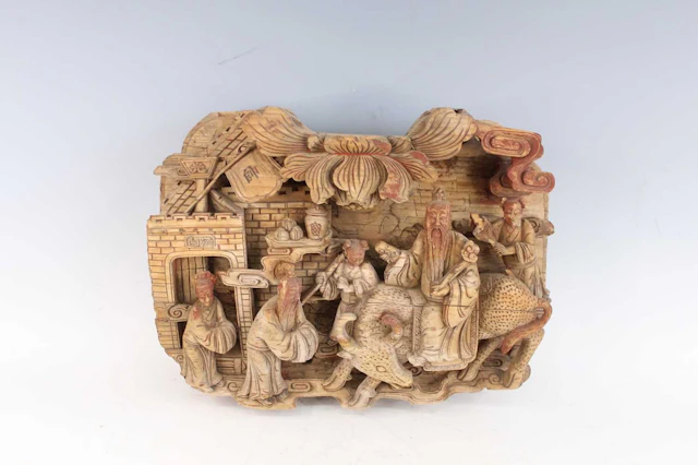 Lot 162 - A Chinese carved wooden figural panel, early