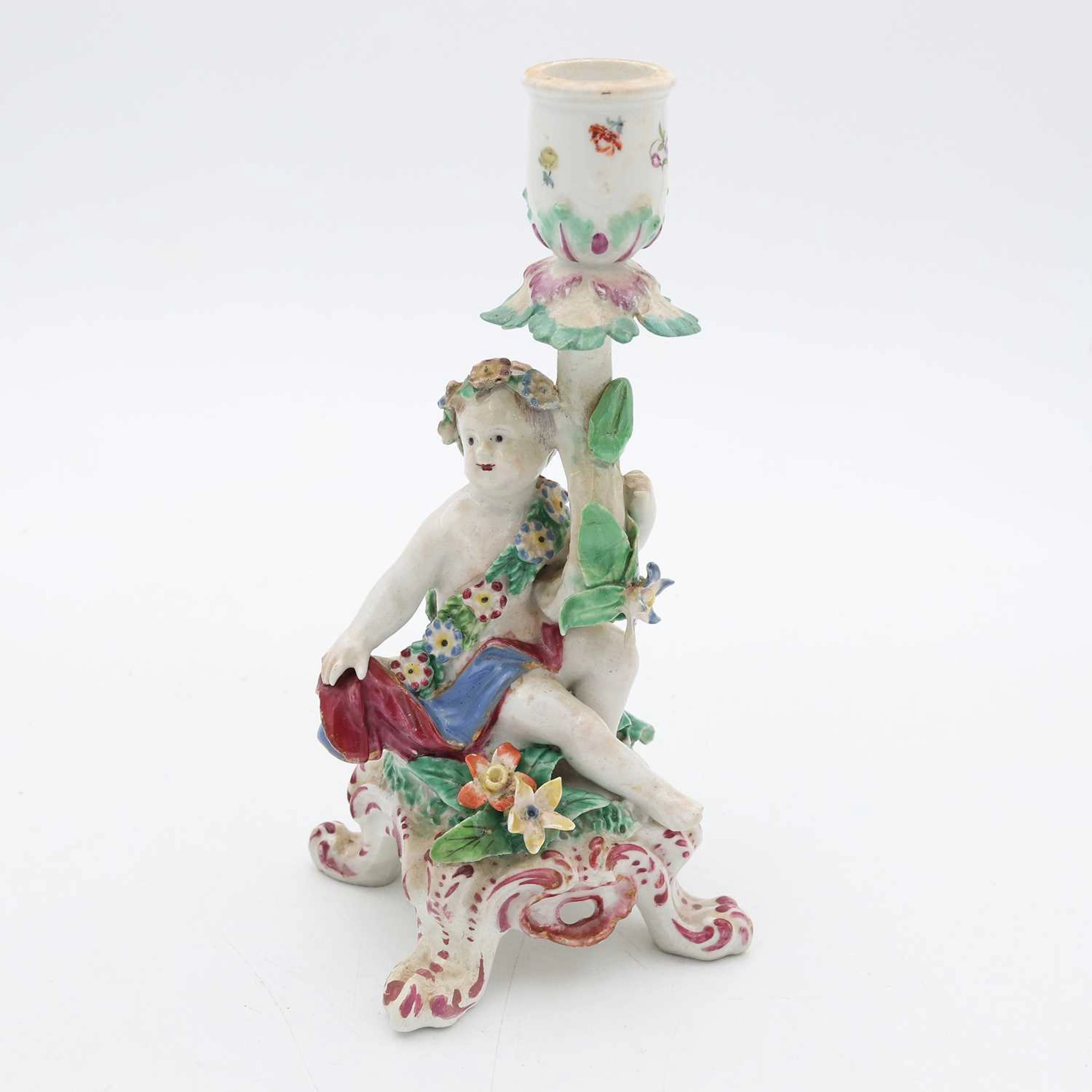 Lot 110 - A Bow porcelain Cupid figural chamberstick