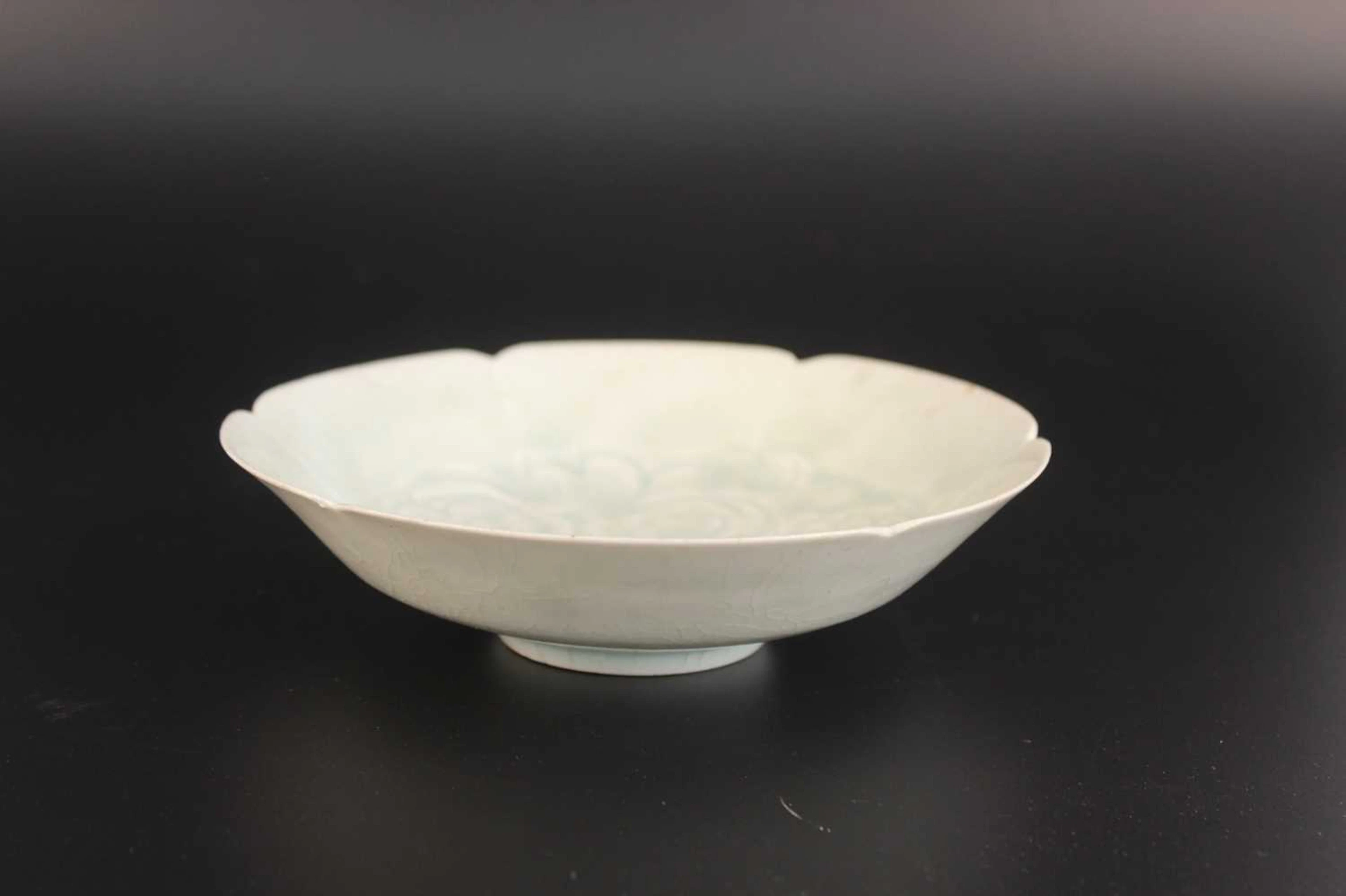 Lot 57 - A Chinese Qingbai-Glazed Carved Floral Bowl