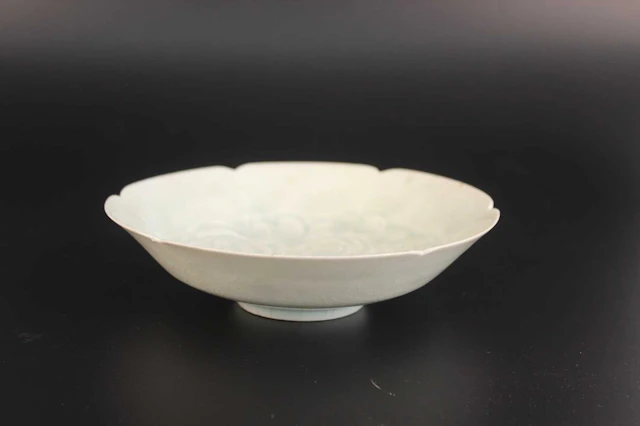 Lot 57 - A Chinese Qingbai-Glazed Carved Floral Bowl