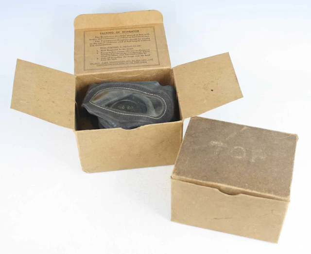 Lot 1118 - A WW II child's respirator, in original box