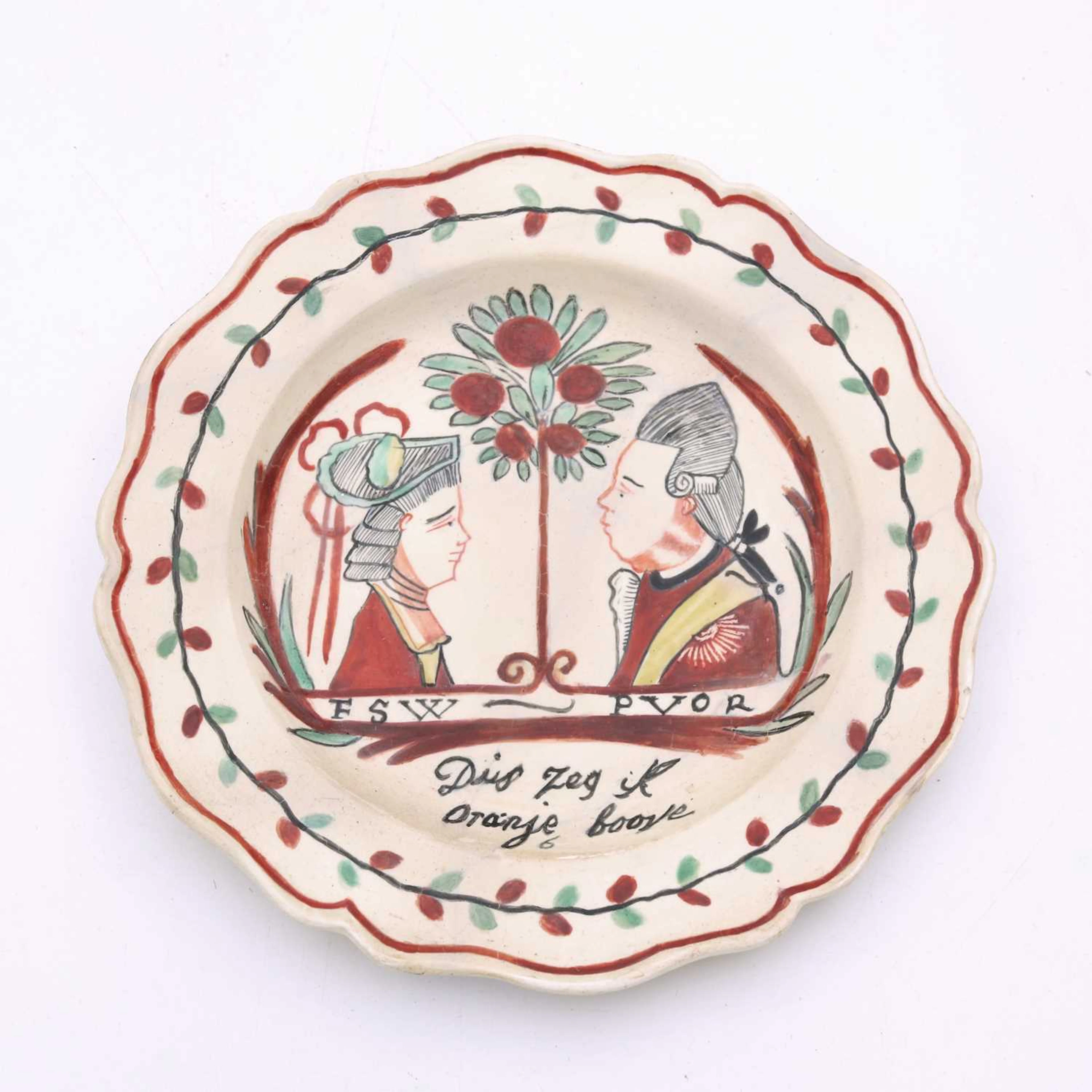 Lot 118 - A Dutch decorated English creamware plate