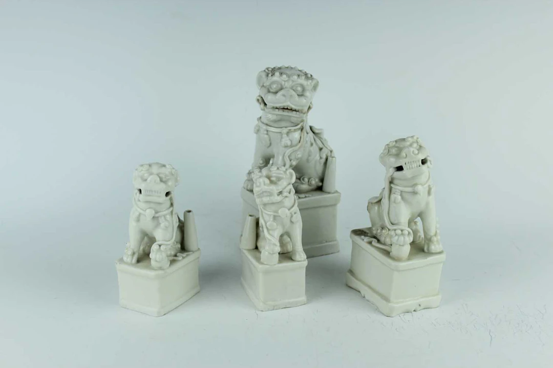 Lot 51 - Four Chinese Dehua blanc-de-Chine Buddhist