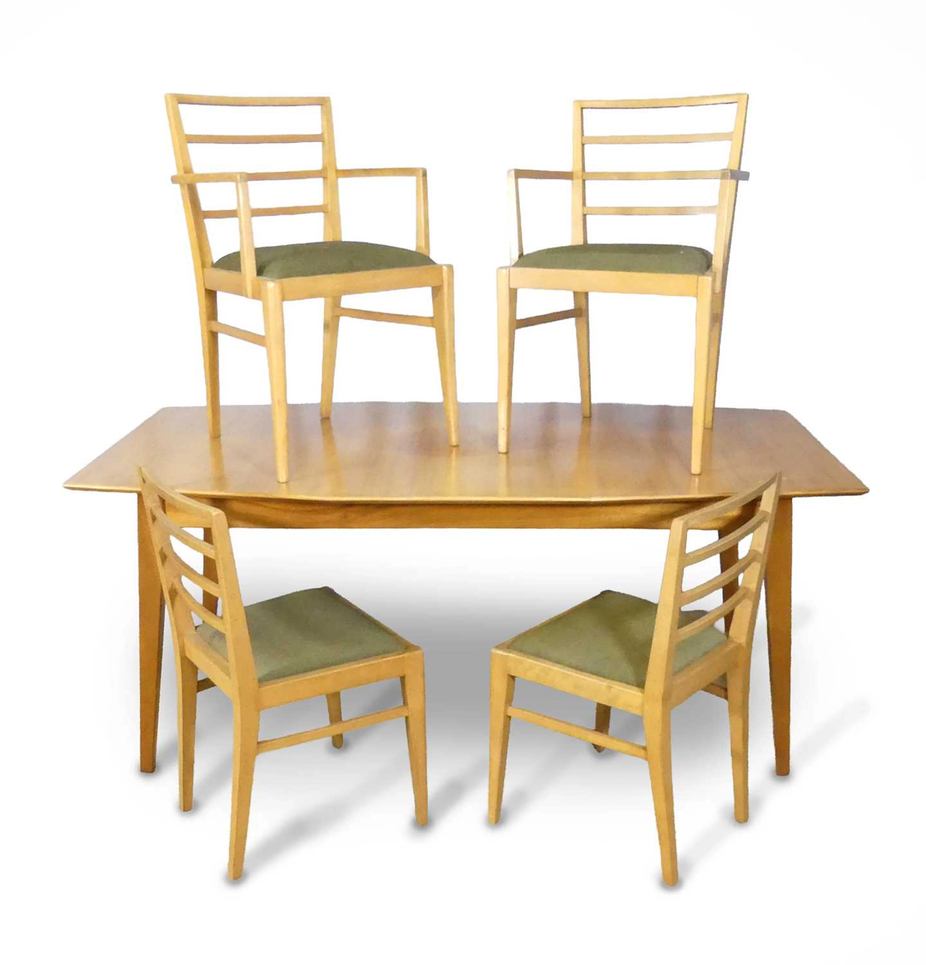Lot 467 - A mid-century walnut dining suite, probably