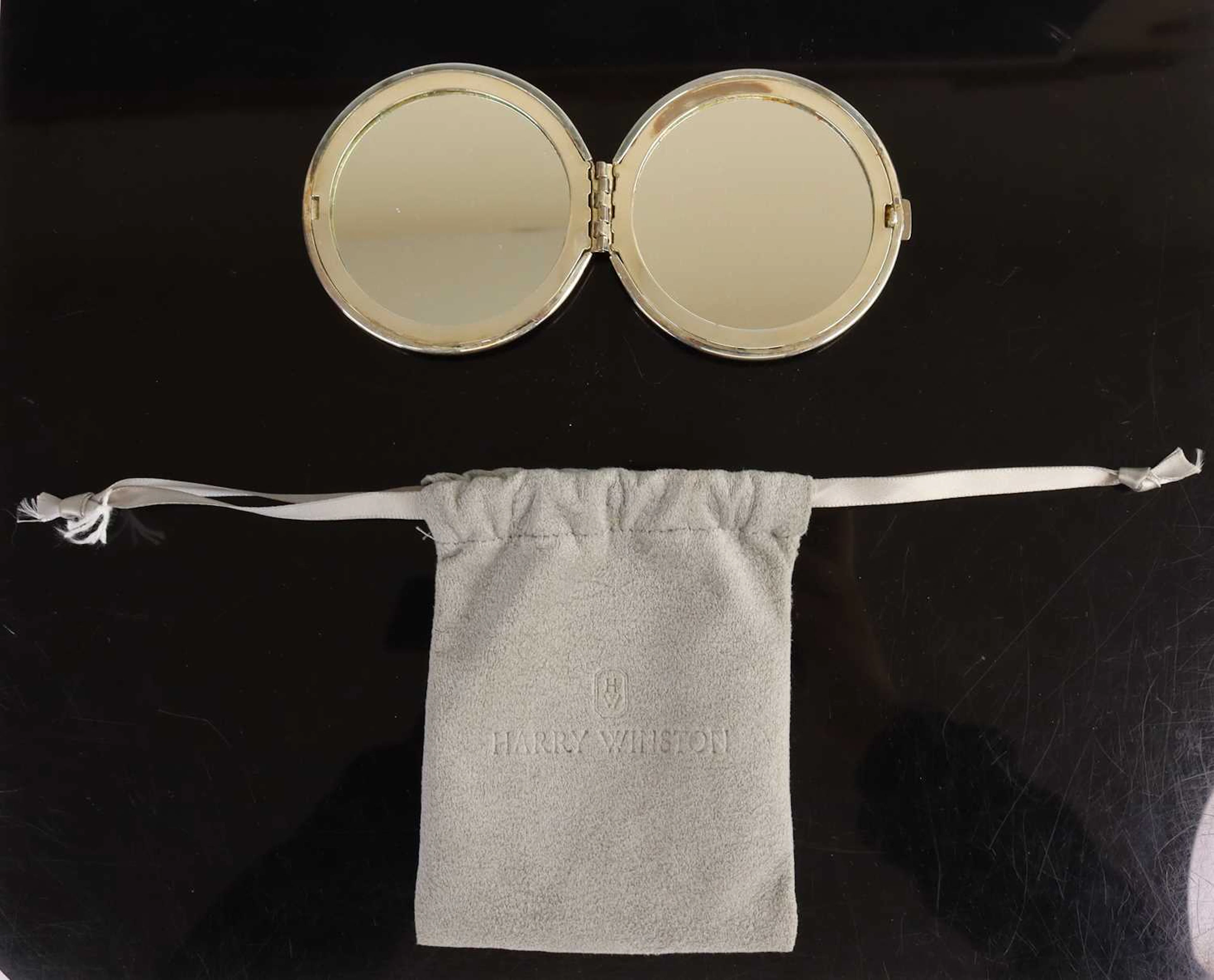 Lot 327 - Harry Winston: an unmarked white metal