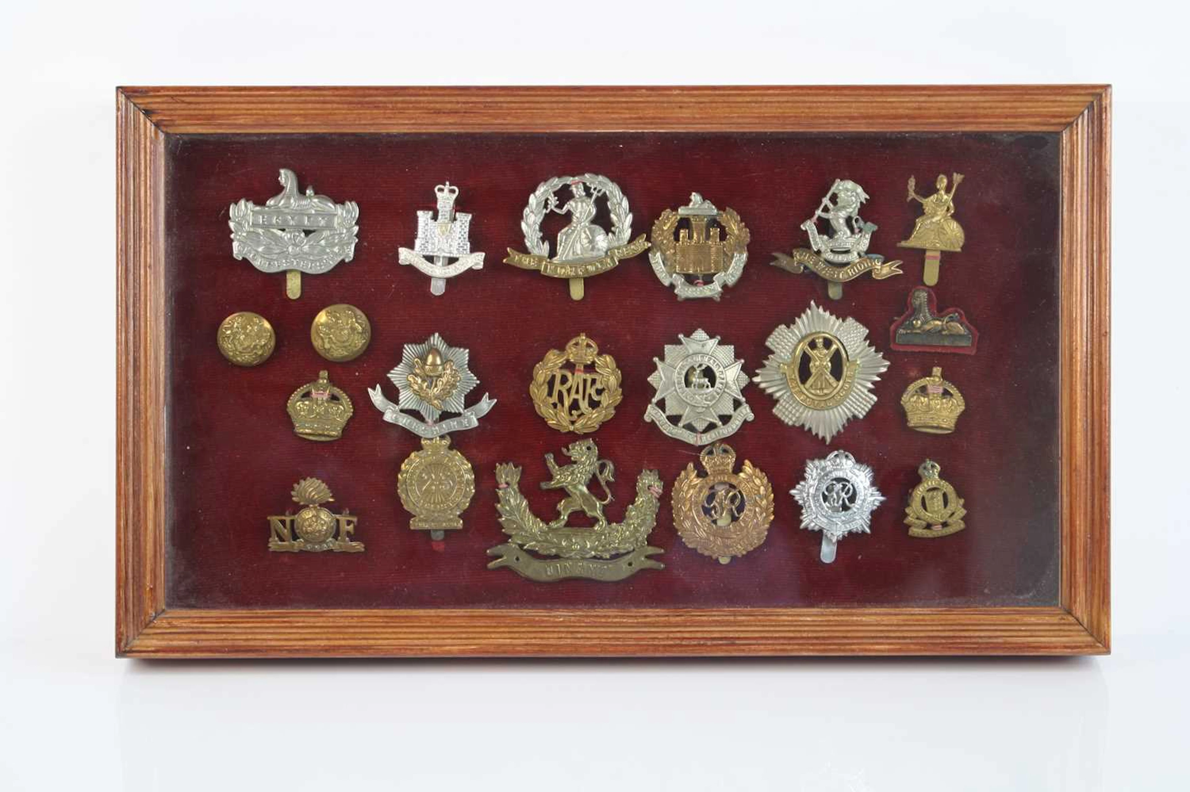 Lot 1163 - A collection of cap badges to include 25th