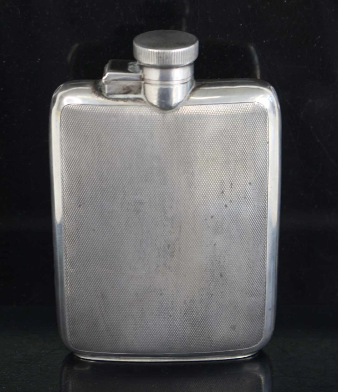 Lot 1320 - A George V silver hip flask, having engine