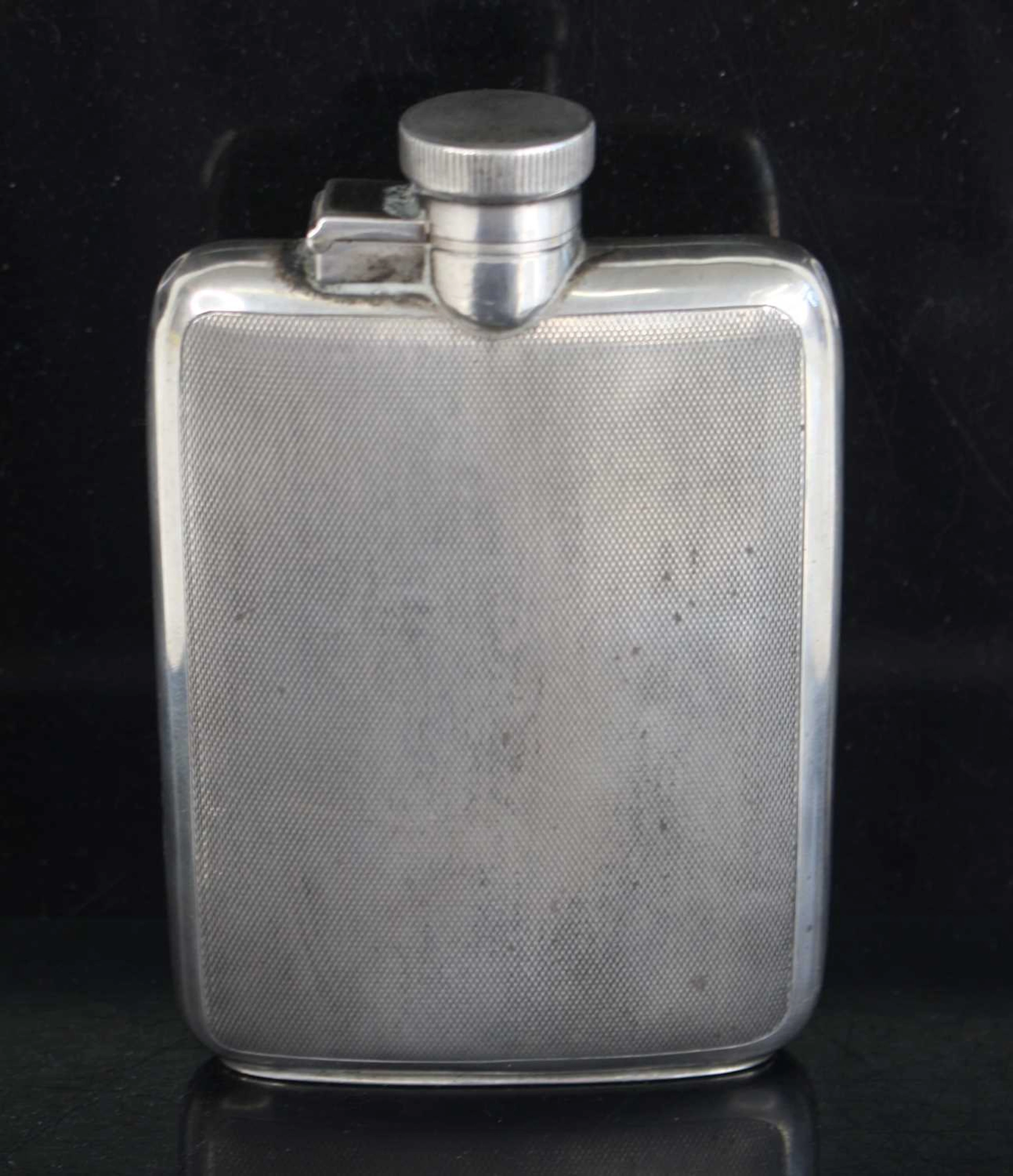 Lot 1320 - A George V silver hip flask, having engine