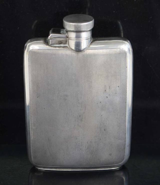 Lot 1320 - A George V silver hip flask, having engine
