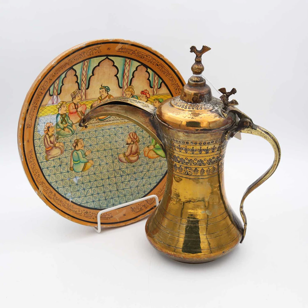 Lot 7 - A Middle Eastern Bedouin brass dallah coffee