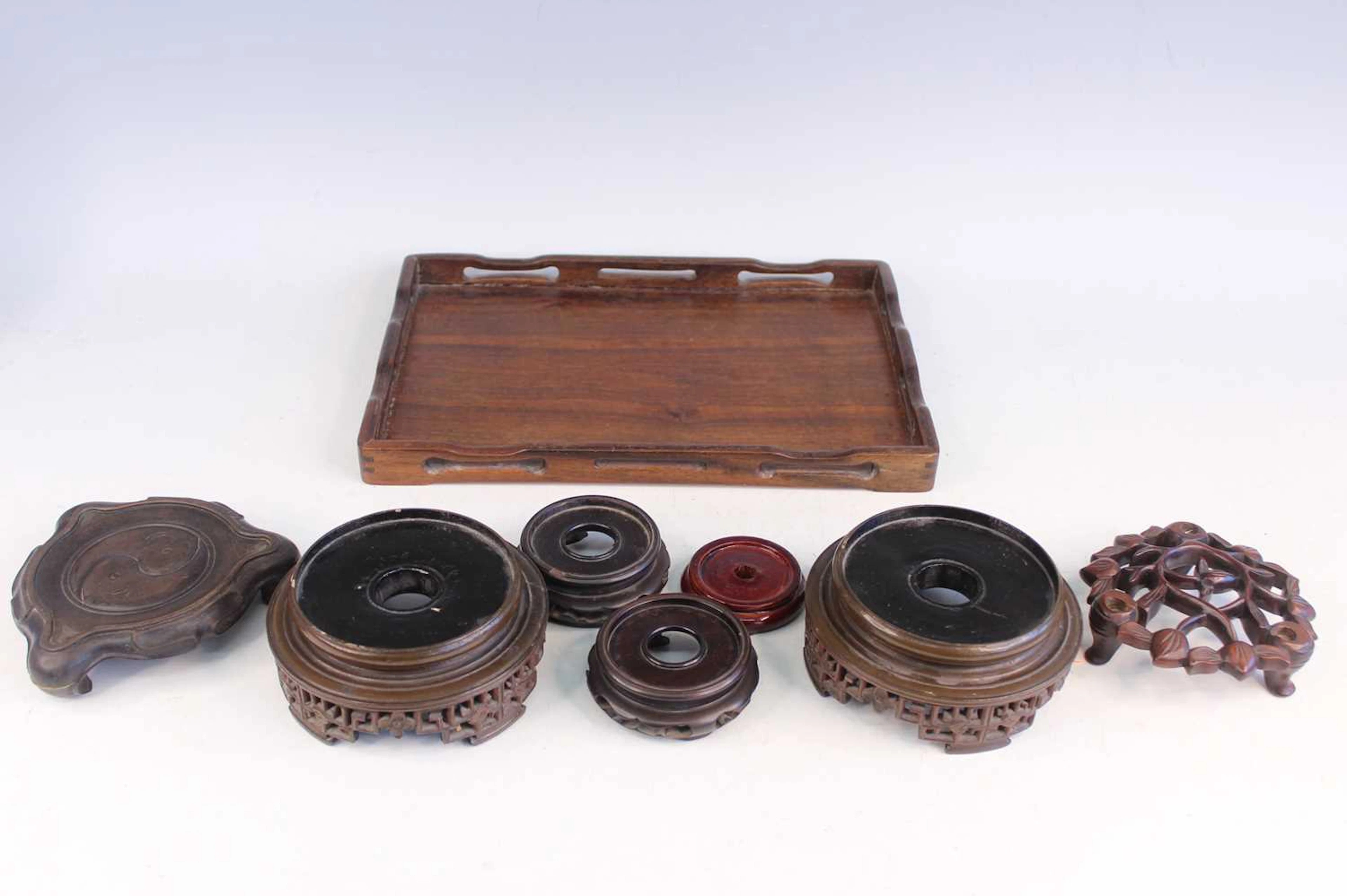 Lot 163 - A Chinese wooden tray and seven carved
